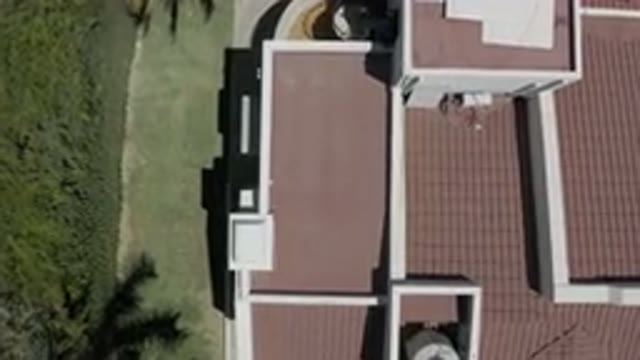 LOS CABOS MEXICO-2019: Flying View Of The Garden Of A House With Red Roof