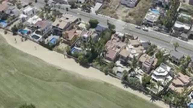 LOS CABOS MEXICO-2019: Overhead View Of Long Green Field And Neighborhood With