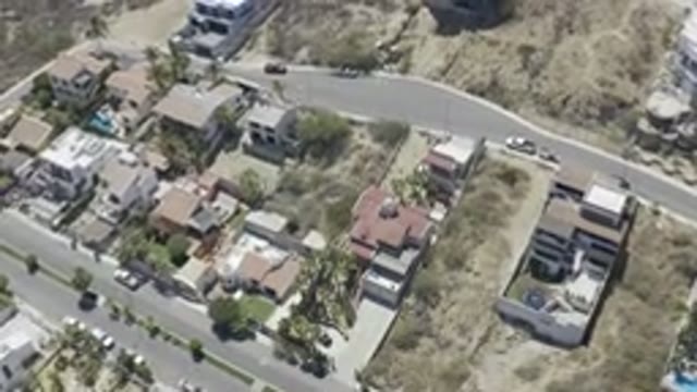 LOS CABOS MEXICO-2019: Camera Flying Over The Top Of Mexico's Houses Nearby A