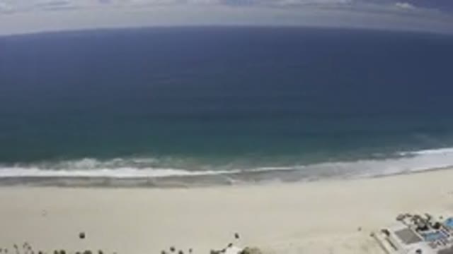 LOS CABOS MEXICO-2019: The Bluish Green Waters Of The Ocean Across The Sandy Beach