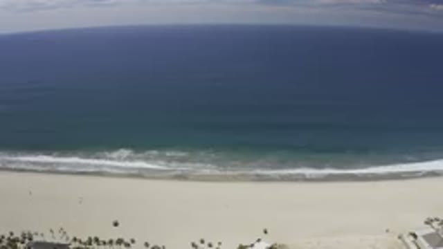 LOS CABOS MEXICO-2019: Camera Slowly Moving Along Coastal City and Sunny Sea