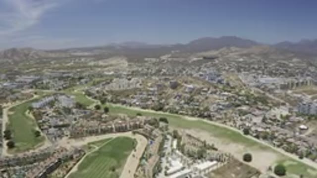 LOS CABOS MEXICO-2019: Drone Video Of A Large City Buildings With Large Green Fields