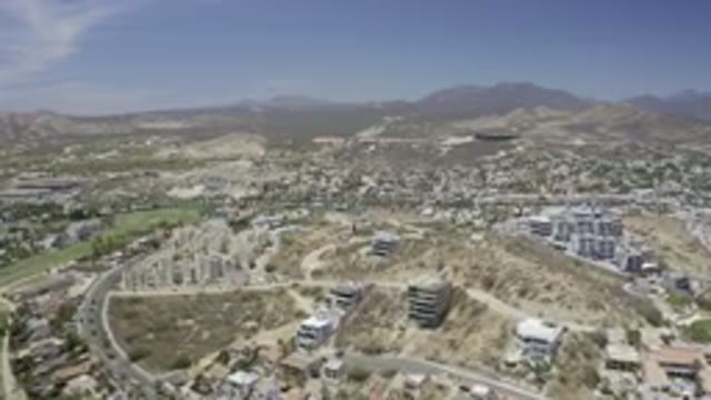 LOS CABOS MEXICO-2019: Bird's Eye View Of Brown Hills With Buildings And Green