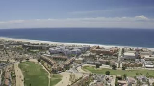 LOS CABOS MEXICO-2019: Aerial Footage Of A Large Water Front City With The Waves