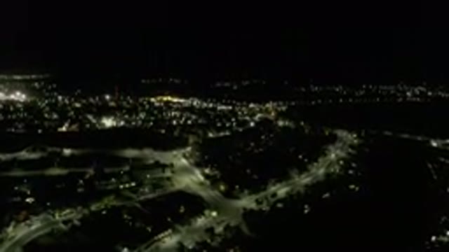 LOS CABOS MEXICO-2019: Dark Sky Night With Brief Glimpses Of Light Around A City