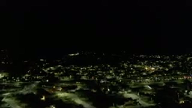 LOS CABOS MEXICO-2019: Flyover At Night City With Lights On Many Buildings Cars