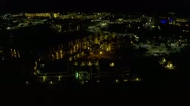 LOS CABOS MEXICO-2019: Camera Pans Down Over Large Building in City