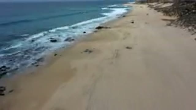 LOS CABOS MEXICO-2019: Overhead Time Lapse Video Of Waves Hitting A Beach On A