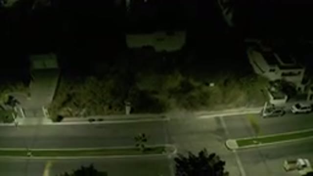 LOS CABOS MEXICO-2019: Bird's Eye View Of Shadowy Street At Night With Cars