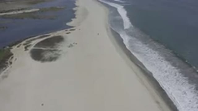 LOS CABOS MEXICO-2019: Aerial Footage Of A Sandy Trail Separating Two Bodies Of