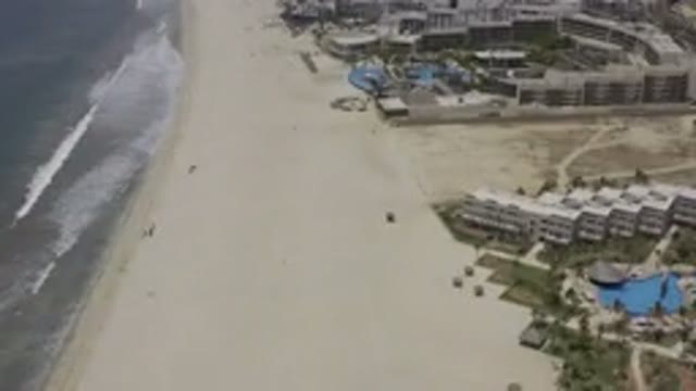 LOS CABOS MEXICO-2019: Beachside View Of Resort Apartments And Waves