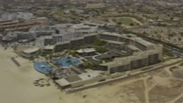 LOS CABOS MEXICO-2019: High Shot of Hotels and Apartments Next to Empty Land on Main Road