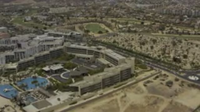 LOS CABOS MEXICO-2019: Aerial View Of A City Hotel Near A Highway With A Pool