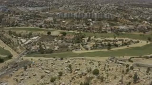 LOS CABOS MEXICO-2019: A Large Field With Buildings And Trees And Grass