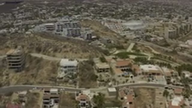 LOS CABOS MEXICO-2019: Overview Of Land Buildings Busy Roads And Lots Of Trees