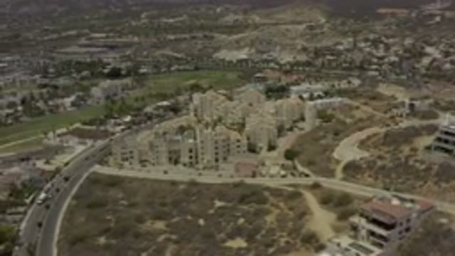 LOS CABOS MEXICO-2019: Top View City Capacity Camera Panning Over Buildings
