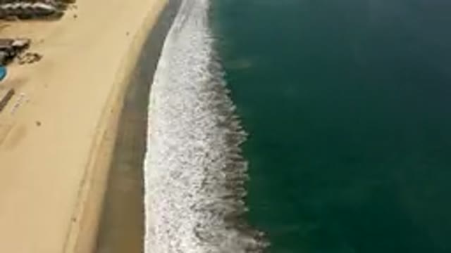 LOS CABOS MEXICO-2019: Fast Forwarded Aerial View Of Beach With Waves Lapping