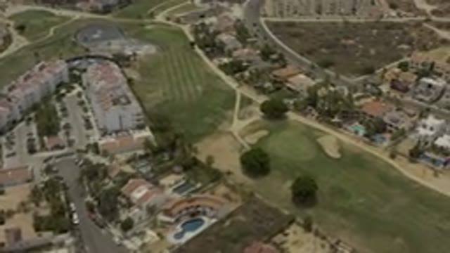 LOS CABOS MEXICO-2019: Top View Of A City With Many Houses And Green Fields