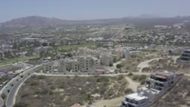 LOS CABOS MEXICO-2019: Drone Footage Of A City With Mountains In The Distance
