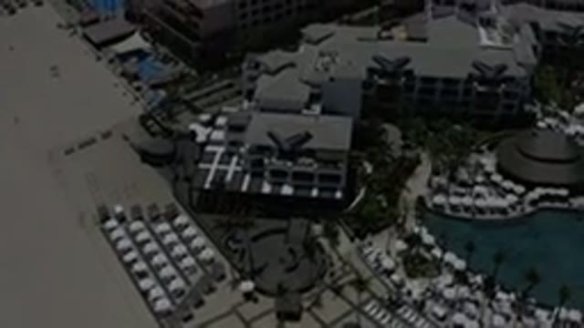 LOS CABOS MEXICO-2019: Drone Video Of A Closed Beach With Large Buildings And A
