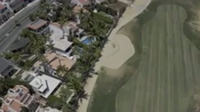 LOS CABOS MEXICO-2019: Flying Over Well Manicured Golf Course And Backyards With