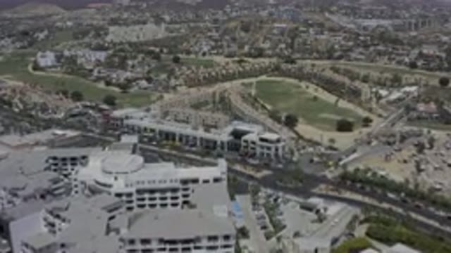 LOS CABOS MEXICO-2019: A Town Or A City Filled With Buildings Traveling Vehicles
