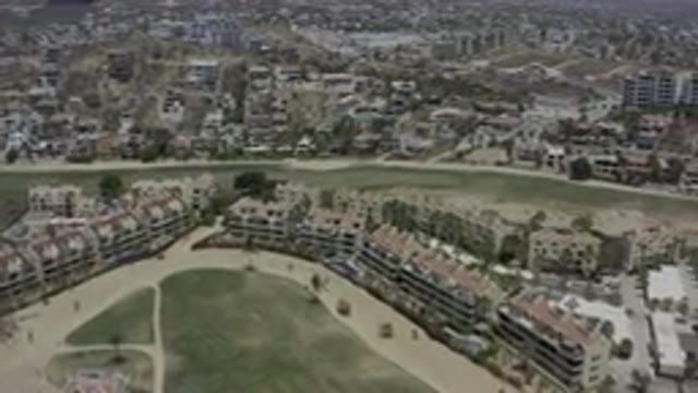 LOS CABOS MEXICO-2019: City Built On Hills With Green Vegetation In The Middle