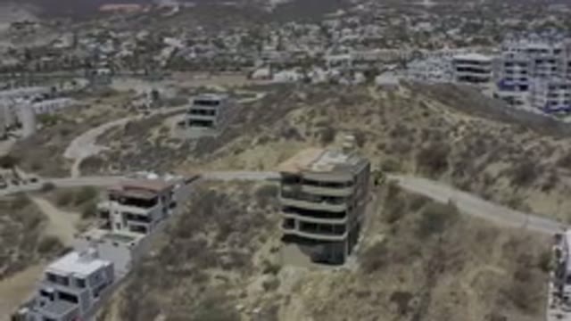 LOS CABOS MEXICO-2019: Sky View Desert City by Highway Sweeping Buildings Built