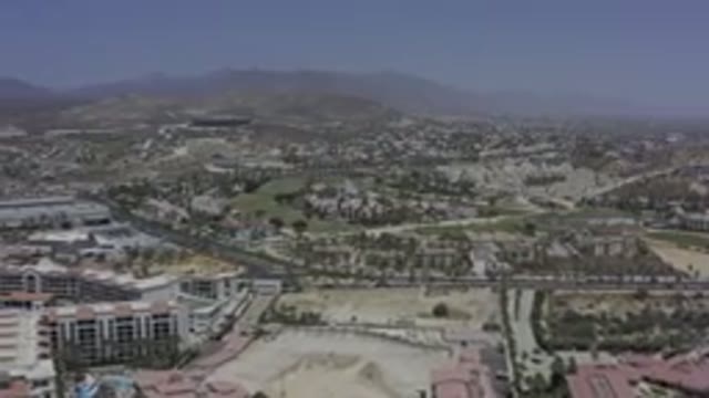 LOS CABOS MEXICO-2019: Drone Footage Over City Buildings Roads Desert Landscape