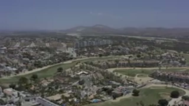 LOS CABOS MEXICO-2019: City Near Mountain Range With Tall Buildings Surrounded