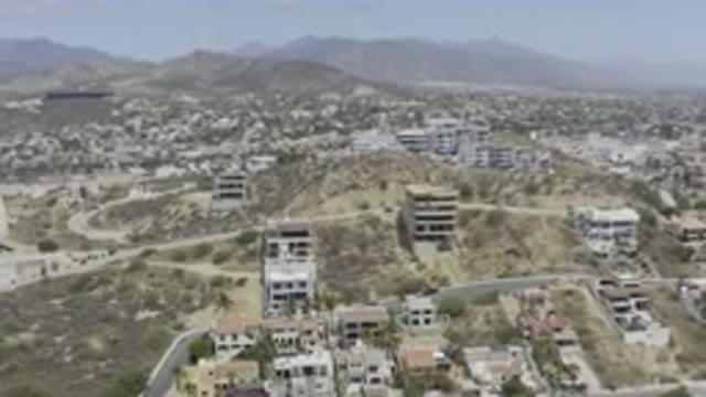 LOS CABOS MEXICO-2019: Bombed Buildings and Craters in Dry Desert Landscape