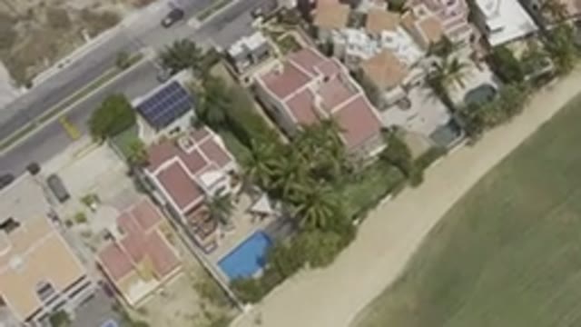 LOS CABOS MEXICO-2019: Drone Video Of Tropical Buildings With Pools In Their Gardens