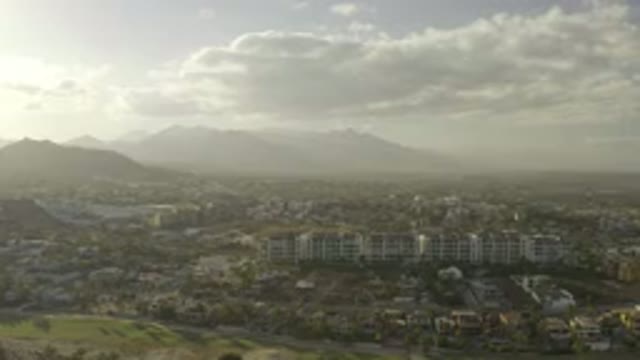 LOS CABOS MEXICO-2019: Puffy White Clouds Roam Through The Sky Above A