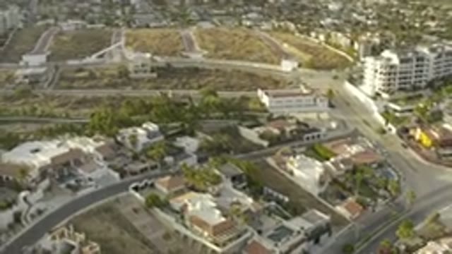LOS CABOS MEXICO-2019: A Lot Of Buildings Surrounded By Trees Roads And Empty