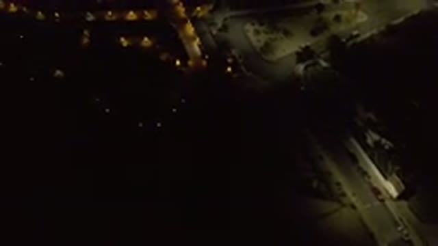 LOS CABOS MEXICO-2019: Flying Slowly At Night Over Streets Lighted With Street