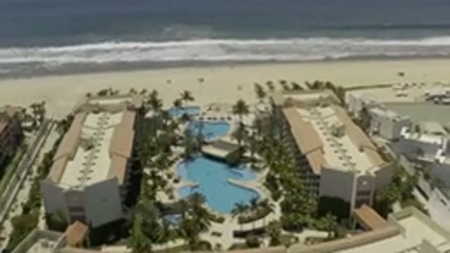 LOS CABOS MEXICO-2019: Flyover Of Beachfront Resort With Beautiful Pools Sand