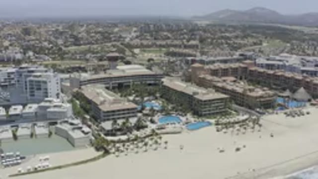 LOS CABOS MEXICO-2019: Panning Drone Footage Of Buildings Along The Ocean