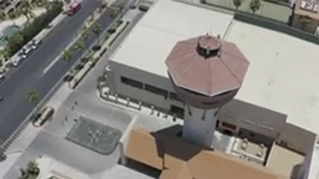 LOS CABOS MEXICO-2019: A White Building With A Tall Tower With A Red Top Is