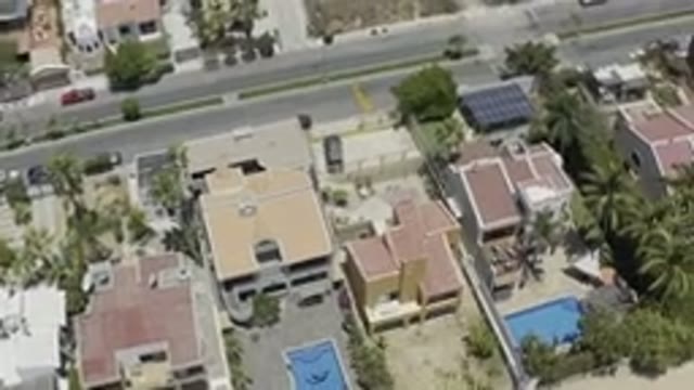 LOS CABOS MEXICO-2019: Top View City Capacity Slow Camera Moving Over Buildings