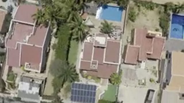 LOS CABOS MEXICO-2019: A Quick Spin On Houses With Red Roofs And A Swimming Pool