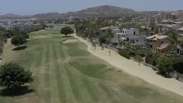 LOS CABOS MEXICO-2019: Overhead View Of A Long Open Golf Course With Buildings