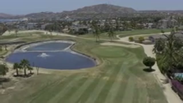 LOS CABOS MEXICO-2019: Lake And Palm Trees In A Country Club With Well Sculpted Lawns