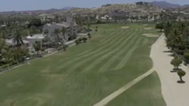 LOS CABOS MEXICO-2019: Large Buildings Form A Barrier Around A Well Landscaped