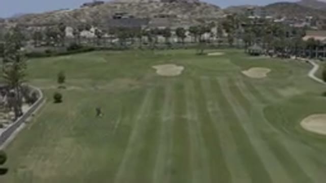 LOS CABOS MEXICO-2019: Camera Movement Over Open Green Field Road Park