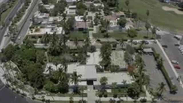 LOS CABOS MEXICO-2019: Drone Footage Over Town Palm Trees Buildings Vehicles