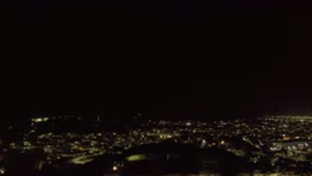LOS CABOS MEXICO-2019: Dark Black Night Moving Video Of Lights Below Beyond City