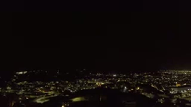 LOS CABOS MEXICO-2019: Drone Footage Over City at Night with Lights on Buildings