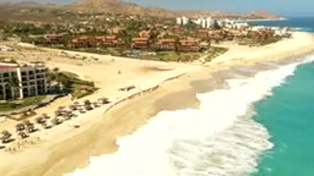 LOS CABOS MEXICO-2019: Sunny Day On A Golden Beach And Iridescent Water Drone