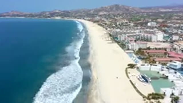 LOS CABOS MEXICO-2019: Drone Footage Sped Up Film Of Beach Waves Rapidly Moving