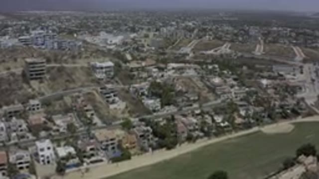 LOS CABOS MEXICO-2019: Buildings And Streets Occupy The Side Of A Hill In An